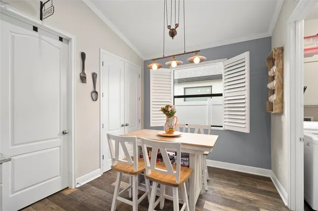 a bathroom with a granite countertop sink a large mirror and shower