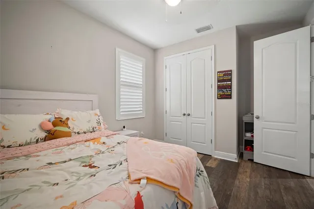 a bathroom with a sink a toilet and shower curtain