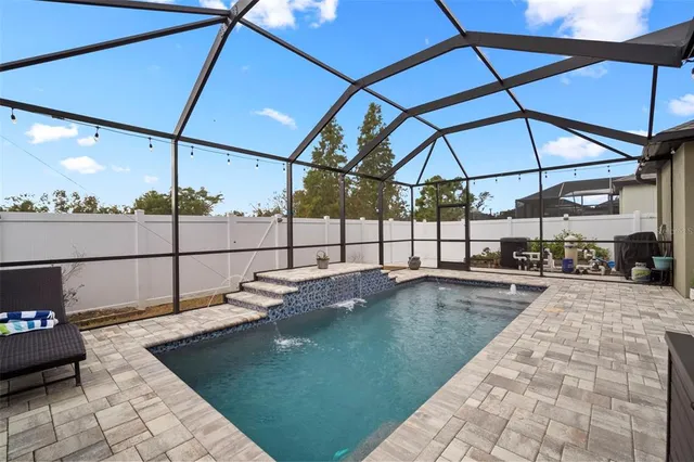an aerial view of residential houses with outdoor space and street view