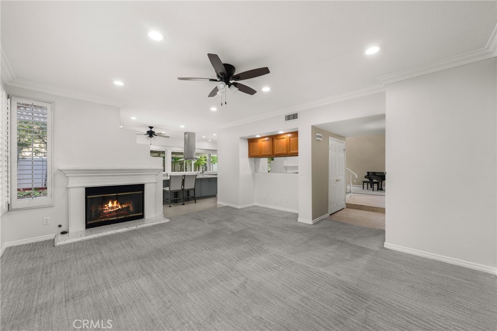 1015 La Salle Circle Corona, CA 92879 - Photo 11 of 56 a view of an empty room with a fireplace