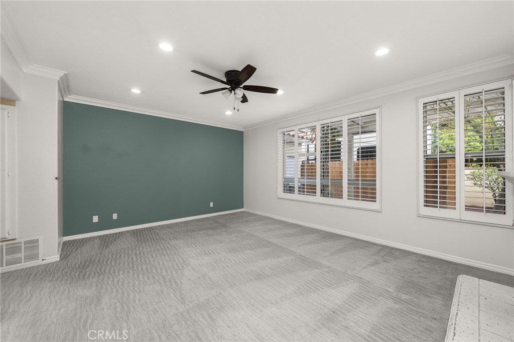 1015 La Salle Circle Corona, CA 92879 - Photo 12 of 56 a view of an empty room with a window and wooden floor
