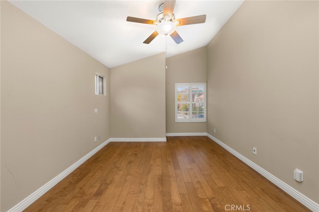 1015 La Salle Circle Corona, CA 92879 - Photo 22 of 56 an empty room with a window and a fan
