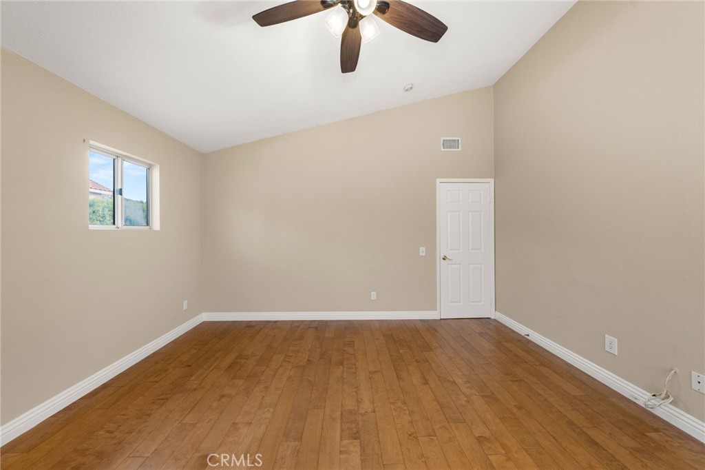 1015 La Salle Circle Corona, CA 92879 - Photo 25 of 56 wooden floor in an empty room with a window
