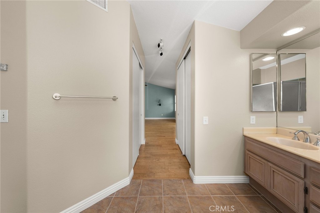 1015 La Salle Circle Corona, CA 92879 - Photo 33 of 56 a bathroom with a sink and mirror