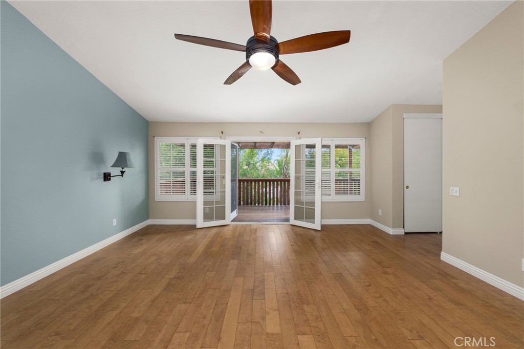 1015 La Salle Circle Corona, CA 92879 - Photo 35 of 56 wooden floor in an empty room with a window