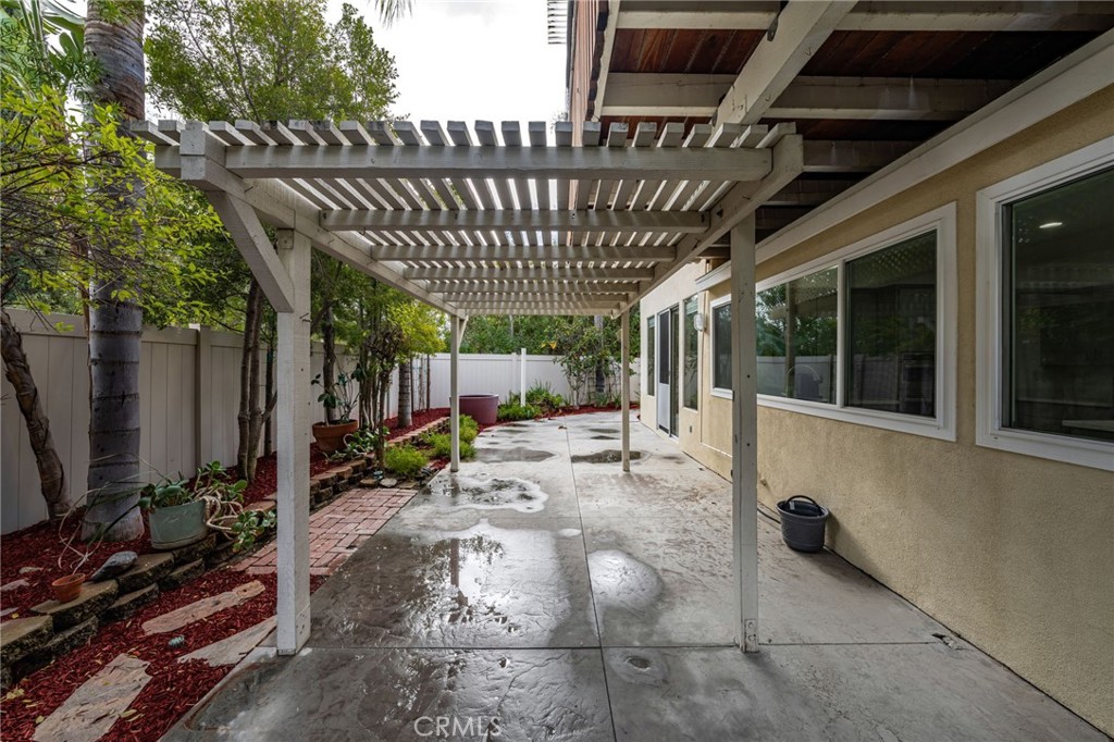 1015 La Salle Circle Corona, CA 92879 - Photo 45 of 56 a view of a porch with furniture and floor to ceiling window