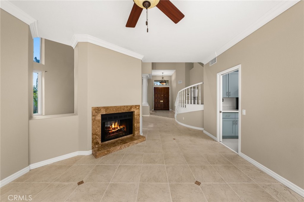 1015 La Salle Circle Corona, CA 92879 - Photo 7 of 56 a living room with furniture and a fireplace