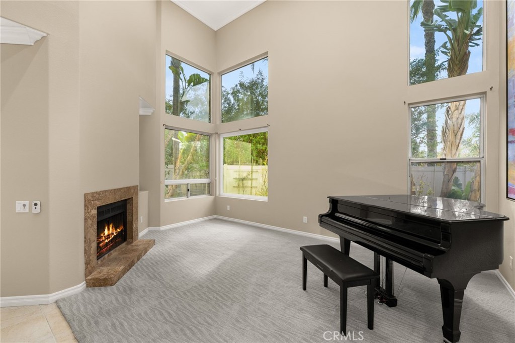 1015 La Salle Circle Corona, CA 92879 - Photo 9 of 56 a view of a livingroom with furniture and a fireplace