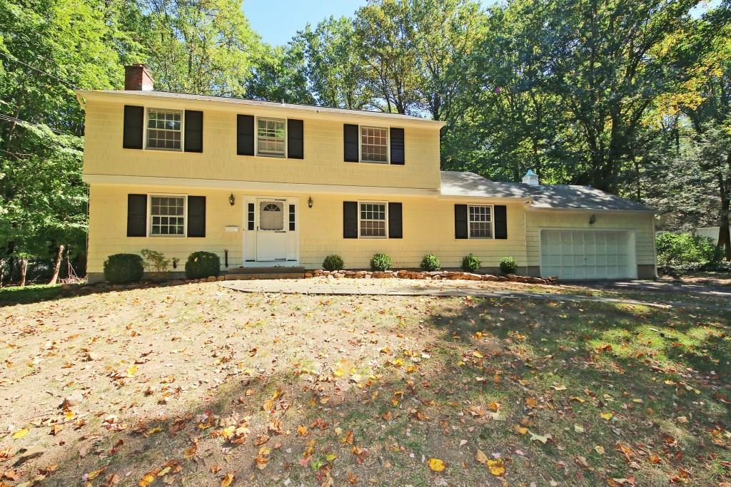 54 Old Washington Road Ridgefield, CT 06877 - Photo 1 of 1 a front view of a house with a yard