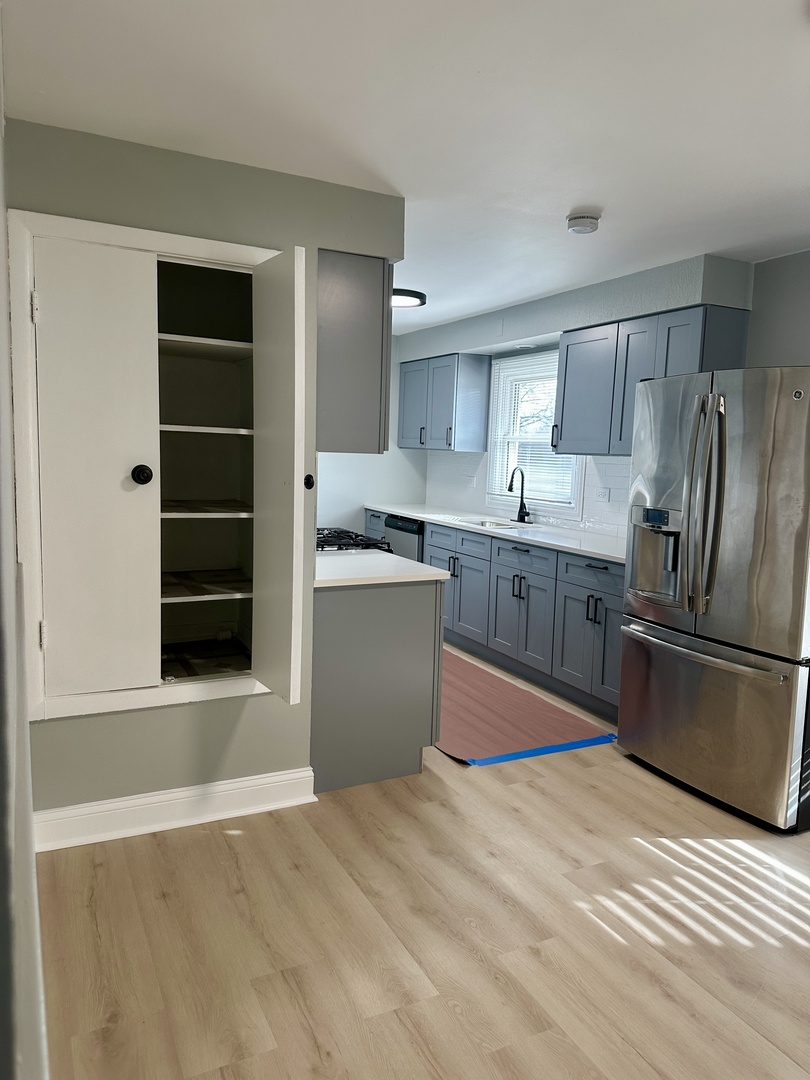 Undisclosed Address Glenwood, IL 60425 - Photo 9 of 17 a kitchen with stainless steel appliances granite countertop a refrigerator sink and cabinets