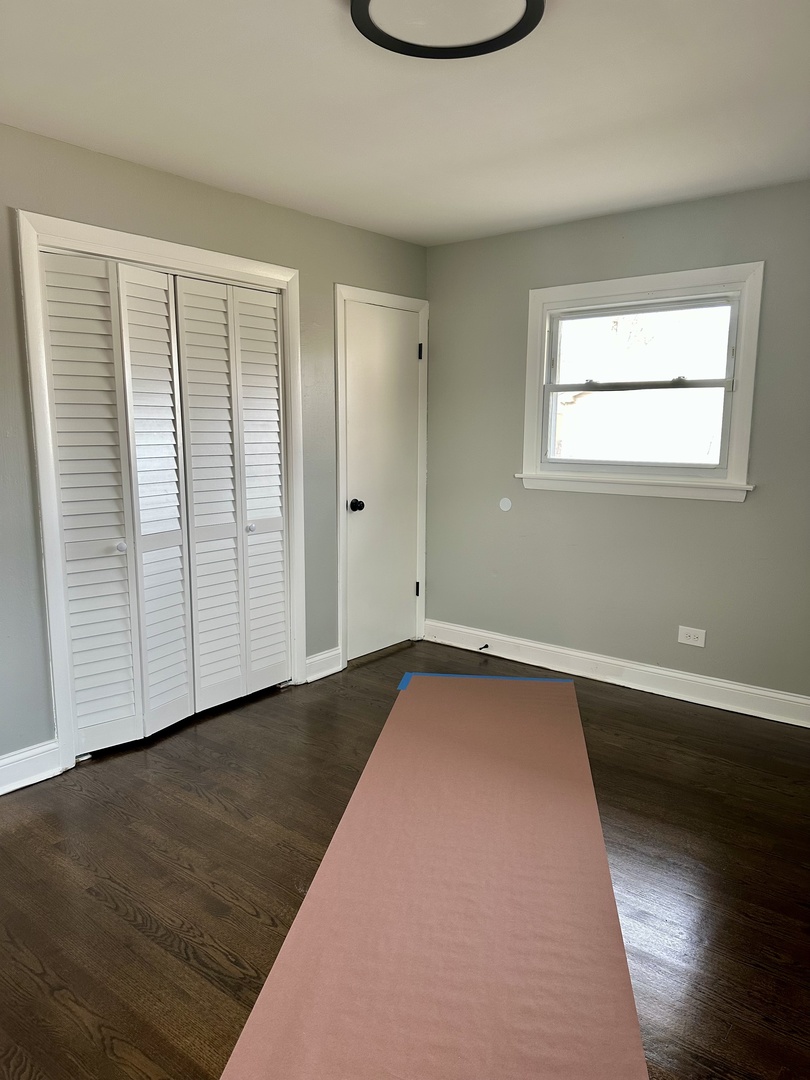 Undisclosed Address Glenwood, IL 60425 - Photo 10 of 17 an empty room with wooden floor and windows