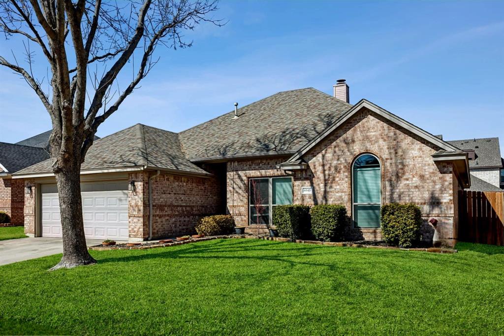 6045 Hillview Drive Watauga, TX 76148 - Photo 1 of 1 a front view of a house with a garden