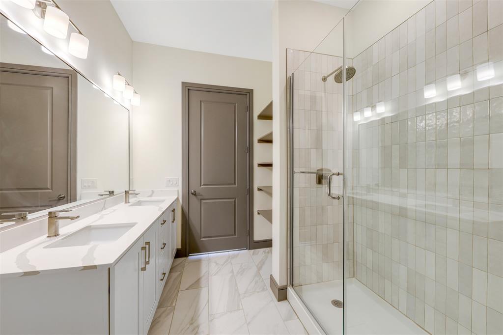 2700 Old Denton Road, Unit 2236 Carrollton, TX 75007 - Photo 11 of 28 a bathroom with a double vanity sink mirror and shower