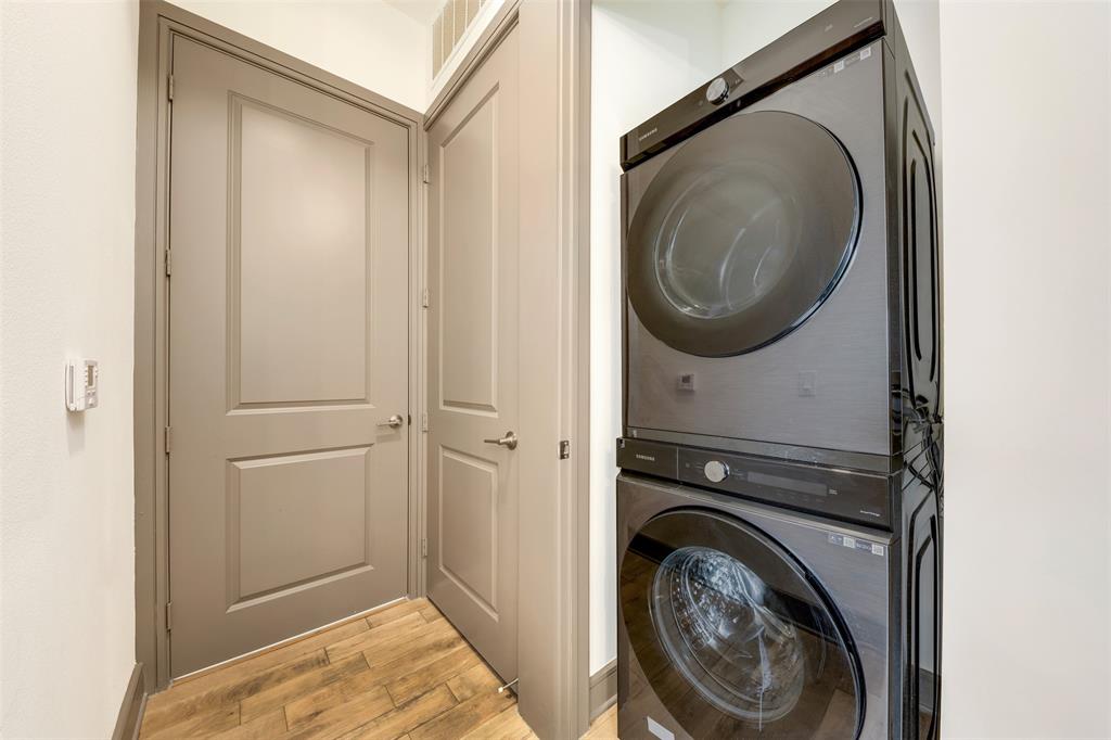 2700 Old Denton Road, Unit 2236 Carrollton, TX 75007 - Photo 20 of 28 a view of a hallway with washer and dryer