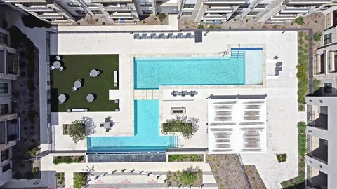 a view of a room with windows and white walls