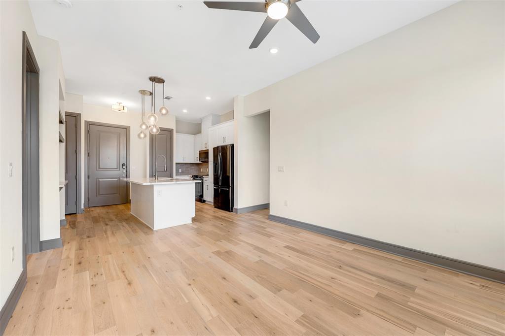 2700 Old Denton Road, Unit 2236 Carrollton, TX 75007 - Photo 4 of 28 a view of a kitchen with a sink and a refrigerator
