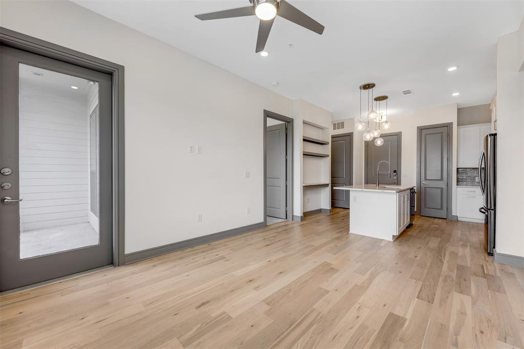 2700 Old Denton Road, Unit 2236 Carrollton, TX 75007 - Photo 5 of 28 a view of an empty room with a kitchen