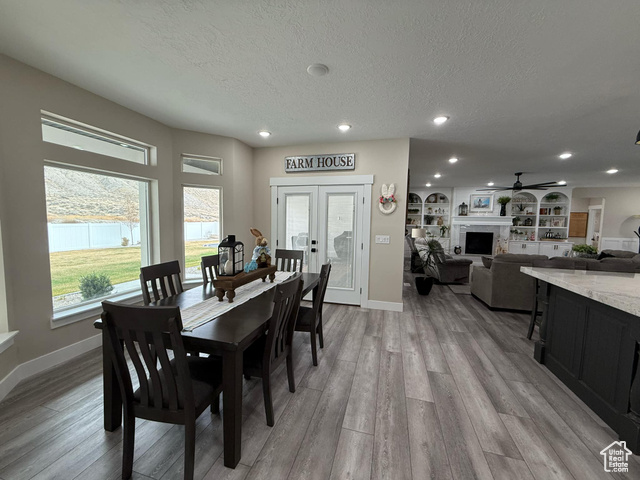 1240 West 2360 North Helper, UT 84526 - Photo 27 of 79 Dining room with a textured ceiling, baseboards, recessed lighting, a ceiling fan, and light wood-style floors