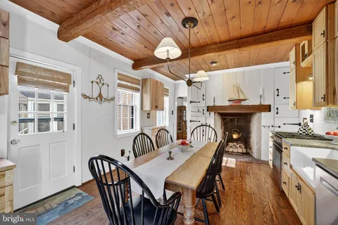 a view of a dining room with furniture and window