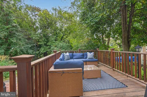 a view of balcony with furniture