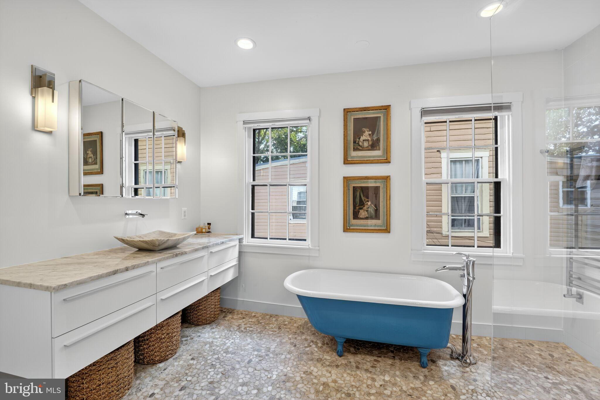 168 Green Street Annapolis, MD 21401 - Photo 22 of 40 a bathroom with a granite countertop tub sink and mirror