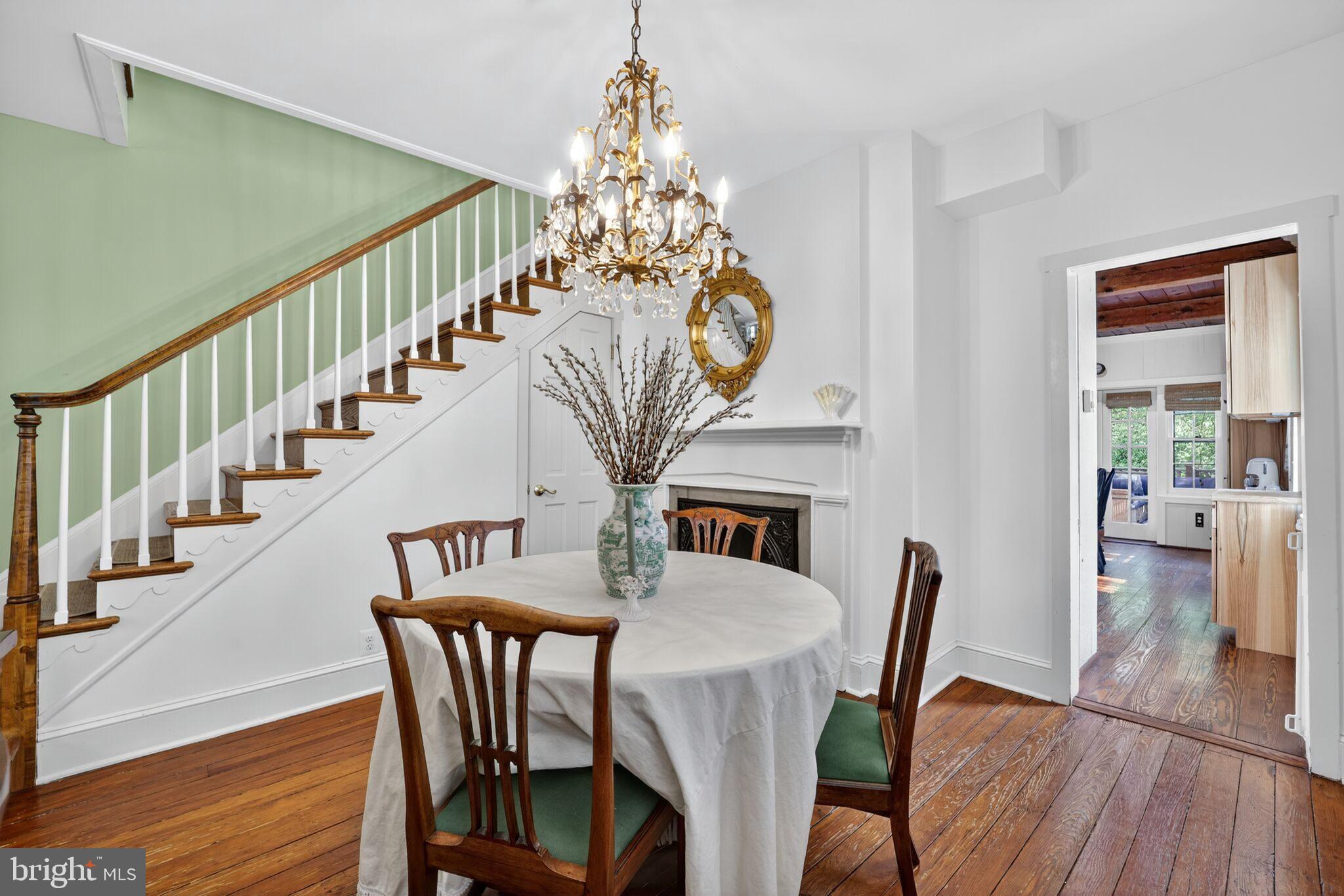 168 Green Street Annapolis, MD 21401 - Photo 8 of 40 a view of a dining room with furniture wooden floor and chandelier
