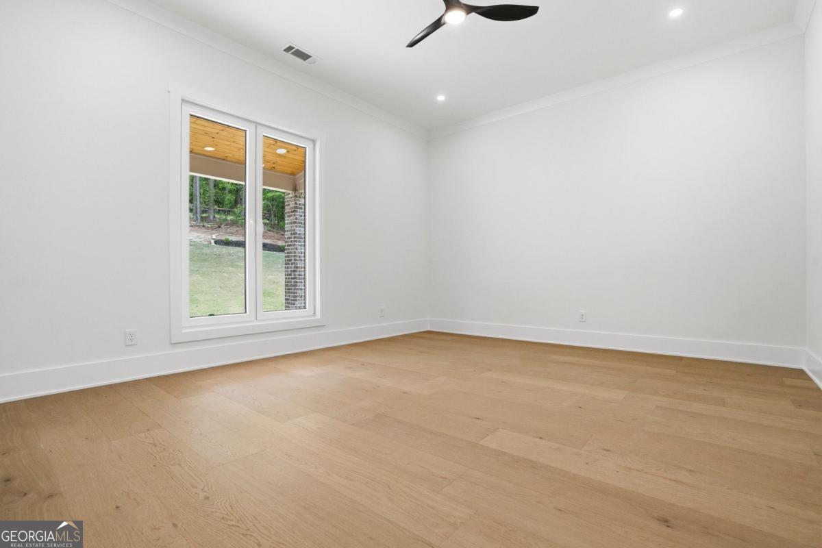 1557 Whitley Road Dacula, GA 30019 - Photo 33 of 46 an empty room with windows