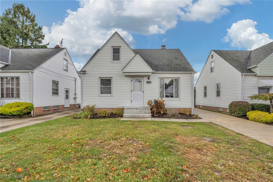 1560 Douglas Road Wickliffe, OH 44092 - Photo 6 of 39 View of front facade with a front lawn and a chimney