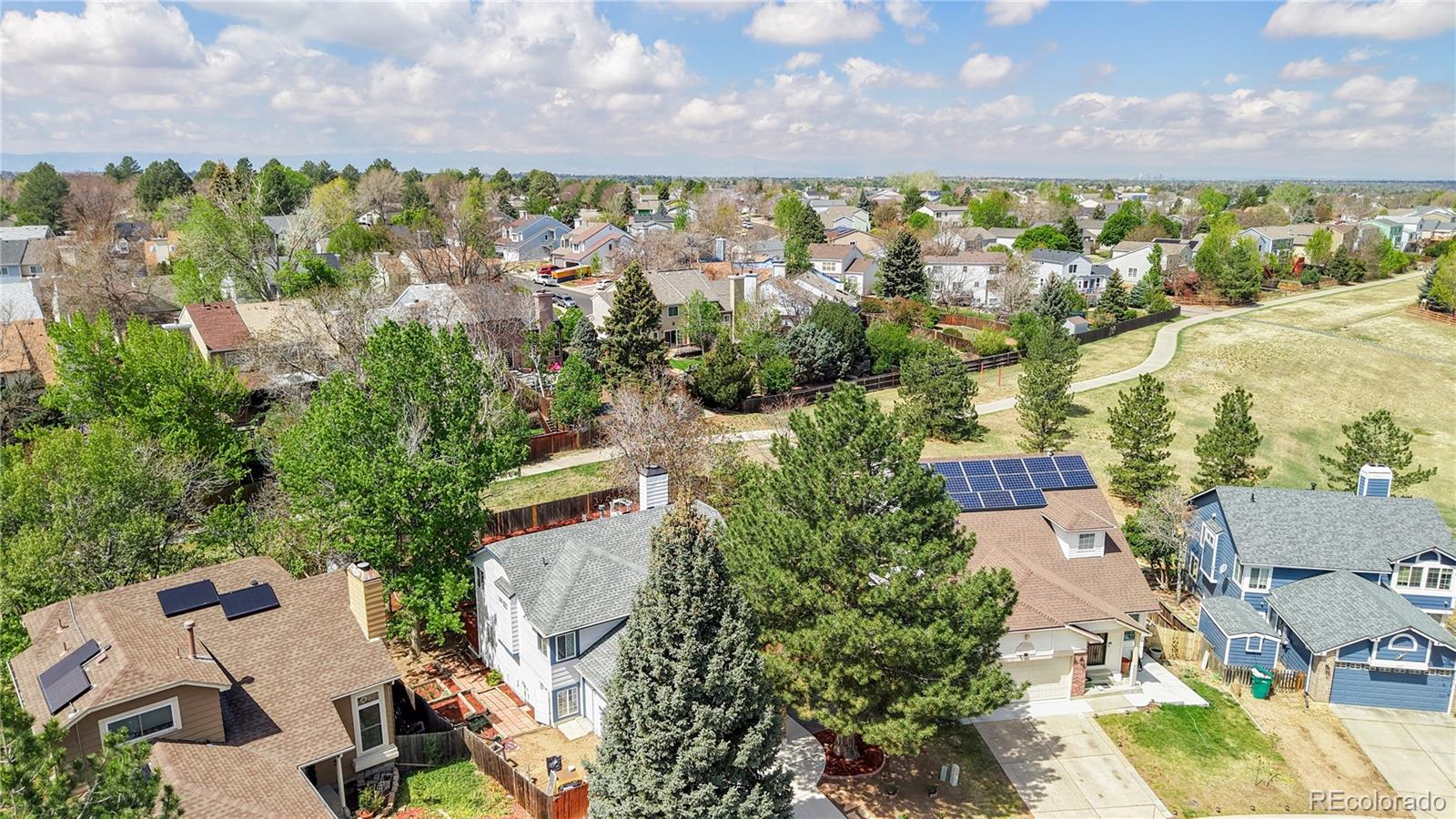 3663 South Flanders Street Aurora, CO 80013 - Photo 24 of 31 an aerial view of residential houses with outdoor space and city view