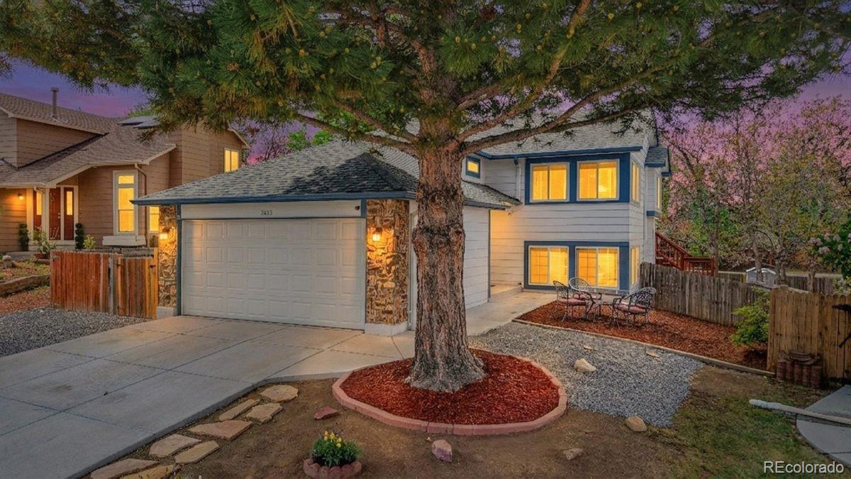 3663 South Flanders Street Aurora, CO 80013 - Photo 31 of 31 a front view of a house with a yard