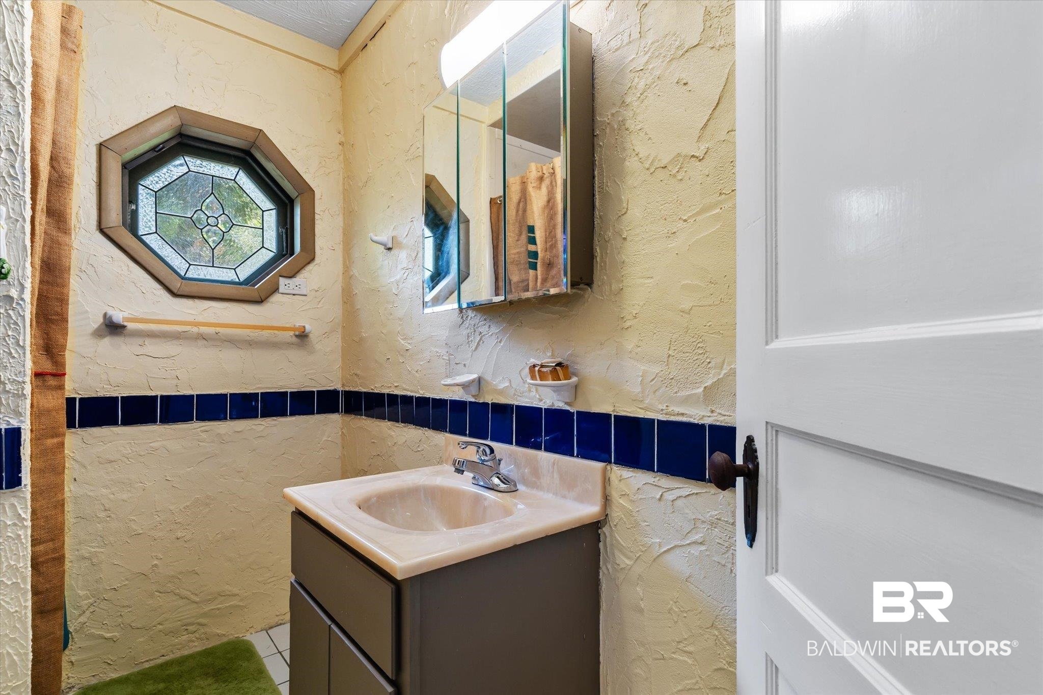 3325 Riviere Du Chien Road Mobile, AL 36693 - Photo 56 of 71 Bathroom with tile walls, tile patterned flooring, and vanity
