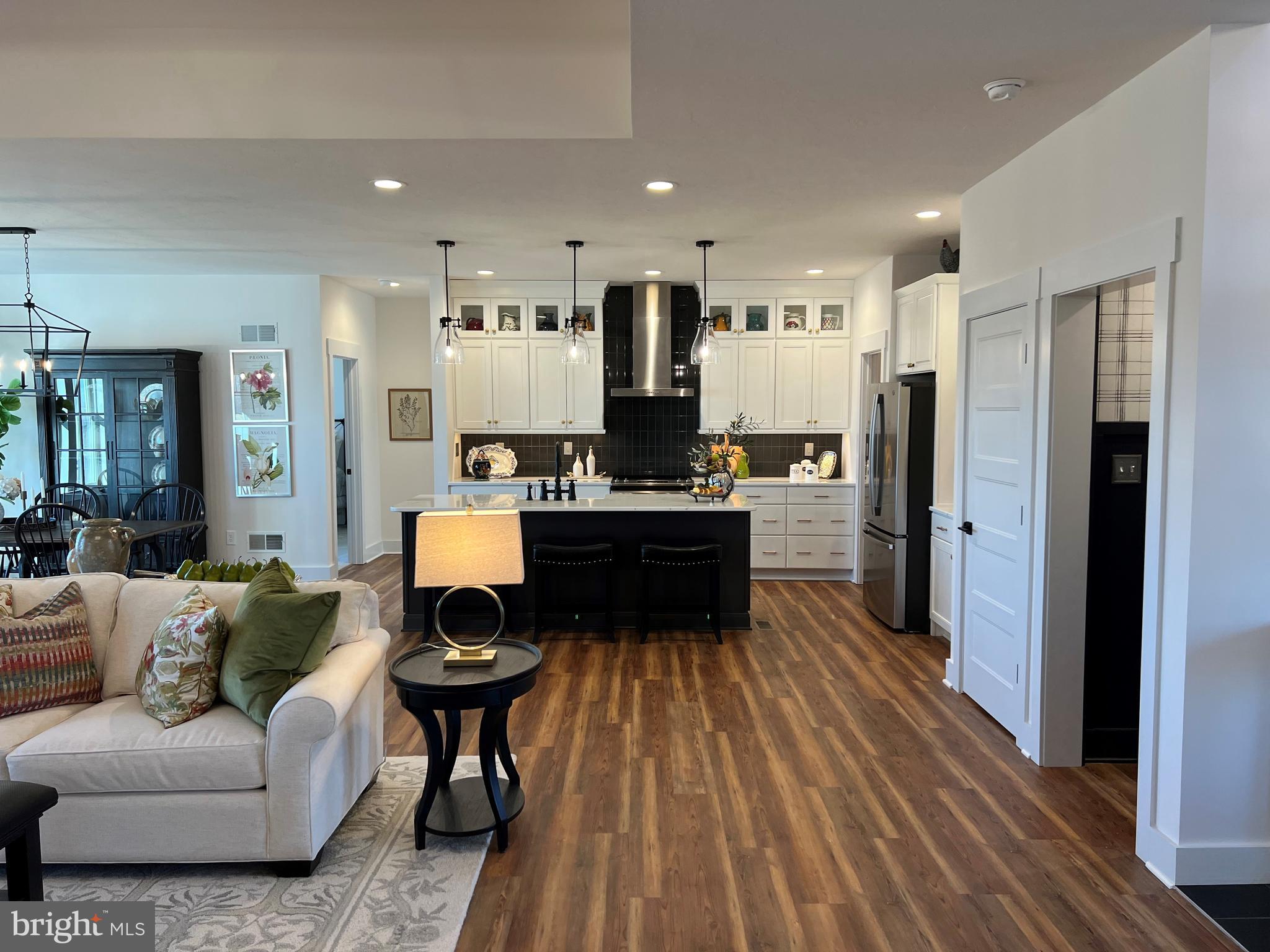 111 Onyx Drive, Unit 55 Hanover, PA 17331 - Photo 4 of 12 a living room with stainless steel appliances furniture and a wooden floor
