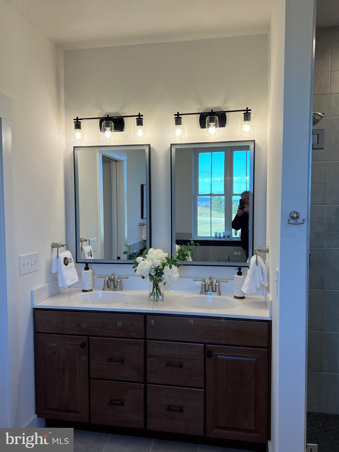 111 Onyx Drive, Unit 55 Hanover, PA 17331 - Photo 8 of 12 a bathroom with a double vanity sink and mirror