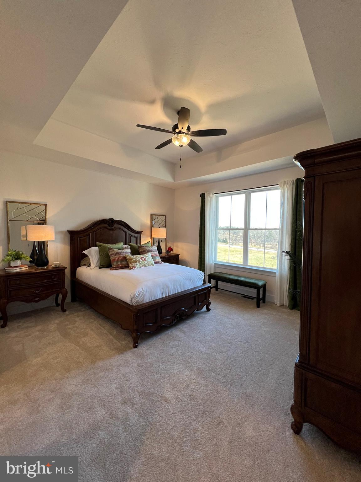 111 Onyx Drive, Unit 55 Hanover, PA 17331 - Photo 9 of 12 a bedroom with a bed and a ceiling fan