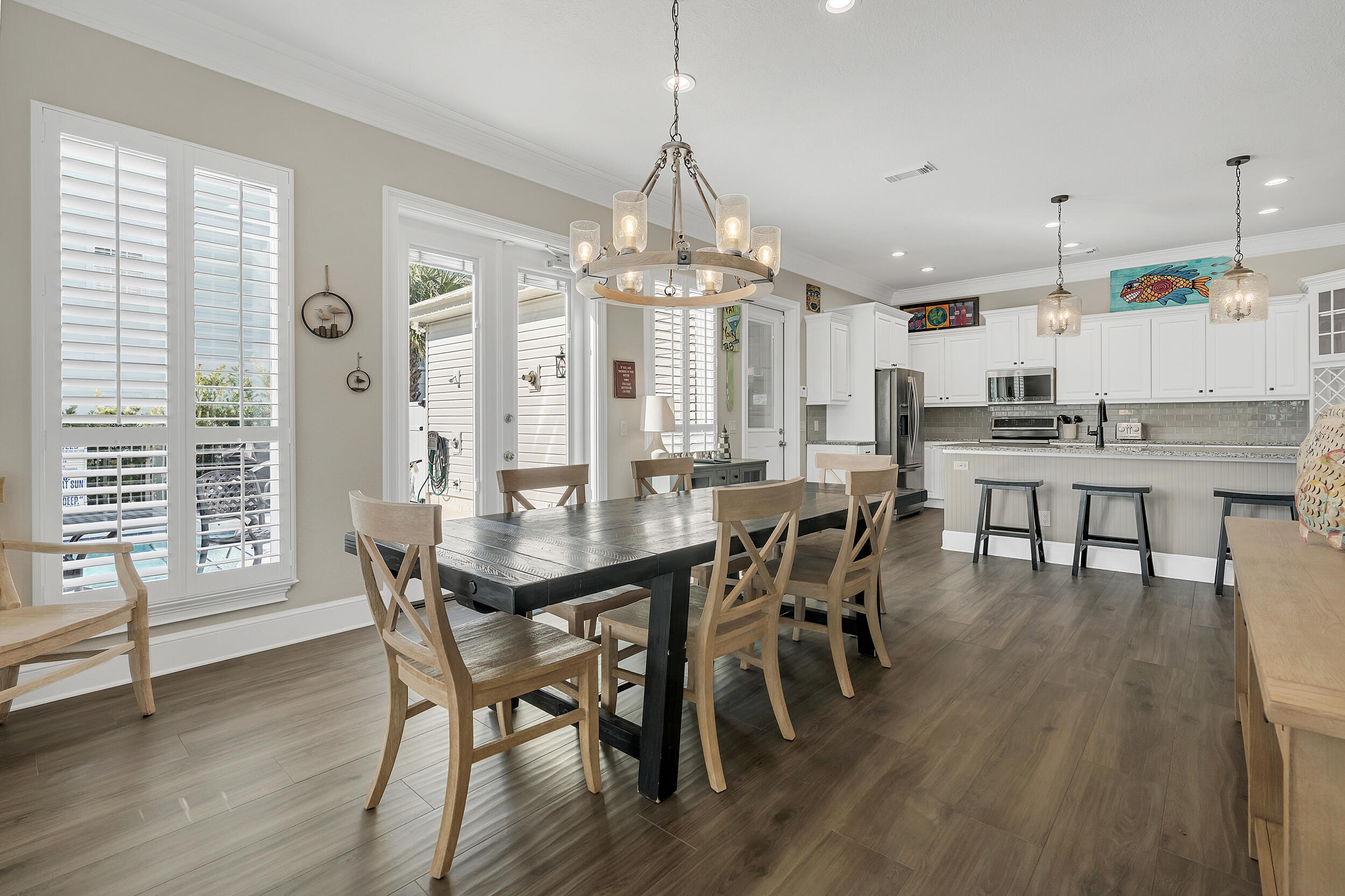 4482 Ocean View Drive Destin, FL 32541 - Photo 11 of 66 a view of a dining room with furniture window and wooden floor