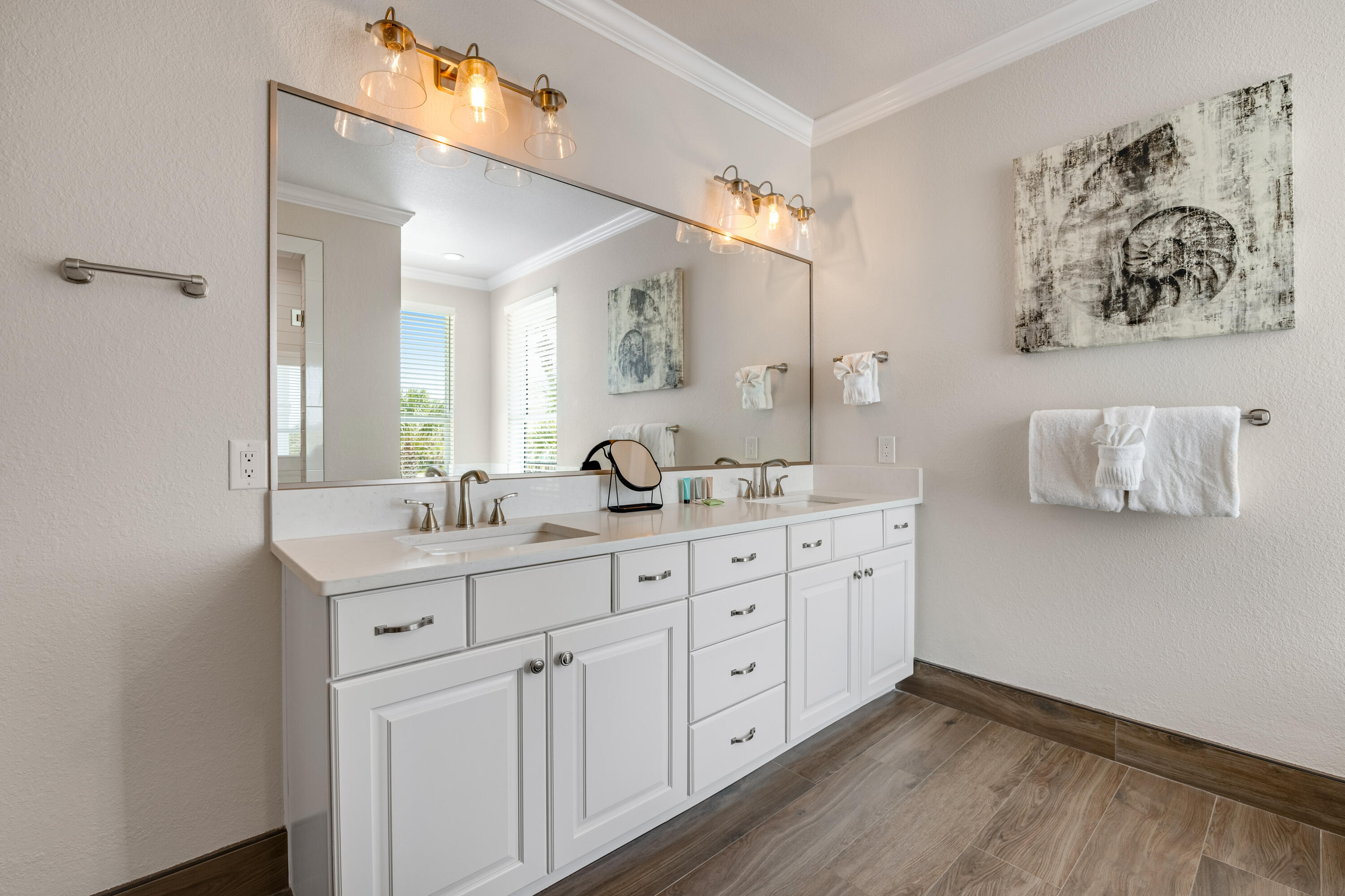 4482 Ocean View Drive Destin, FL 32541 - Photo 34 of 66 a spacious bathroom with a granite countertop sink and a mirror