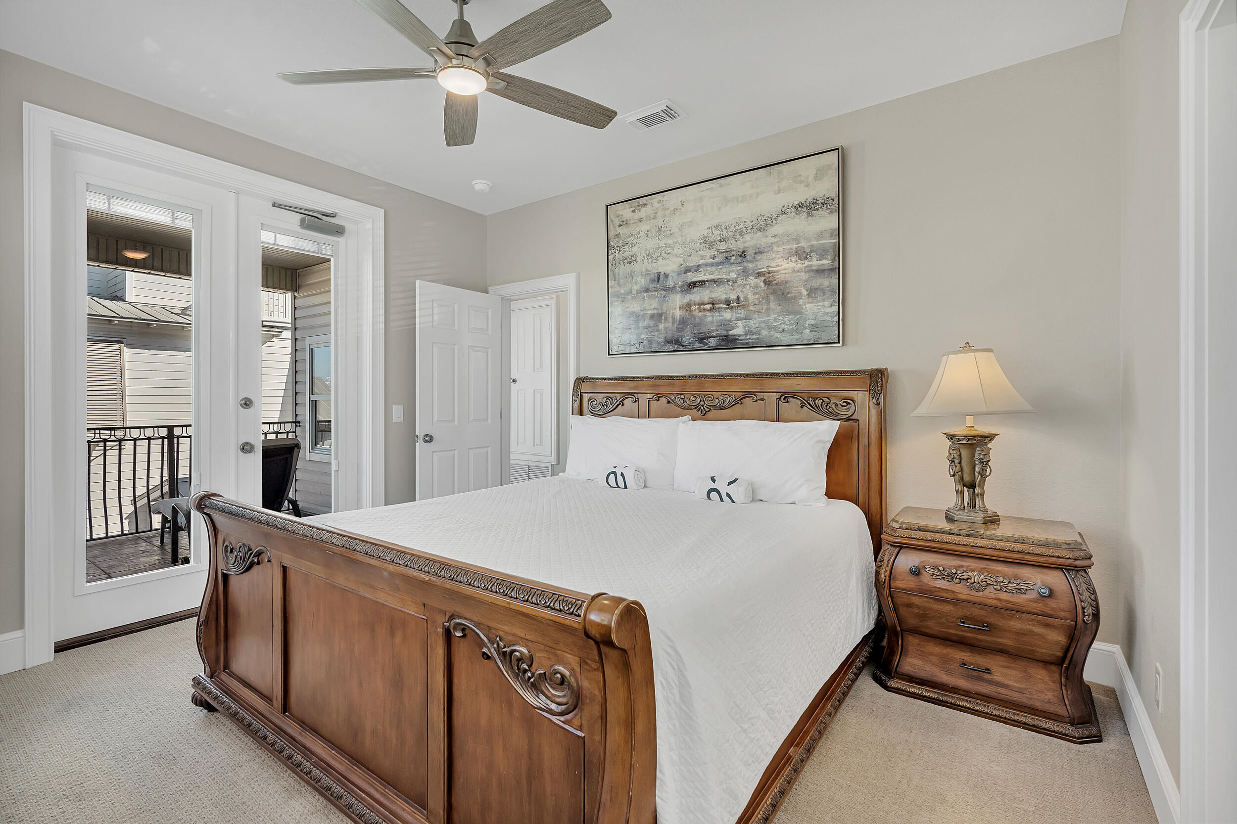 4482 Ocean View Drive Destin, FL 32541 - Photo 41 of 66 a spacious bedroom with a bed and a chandelier