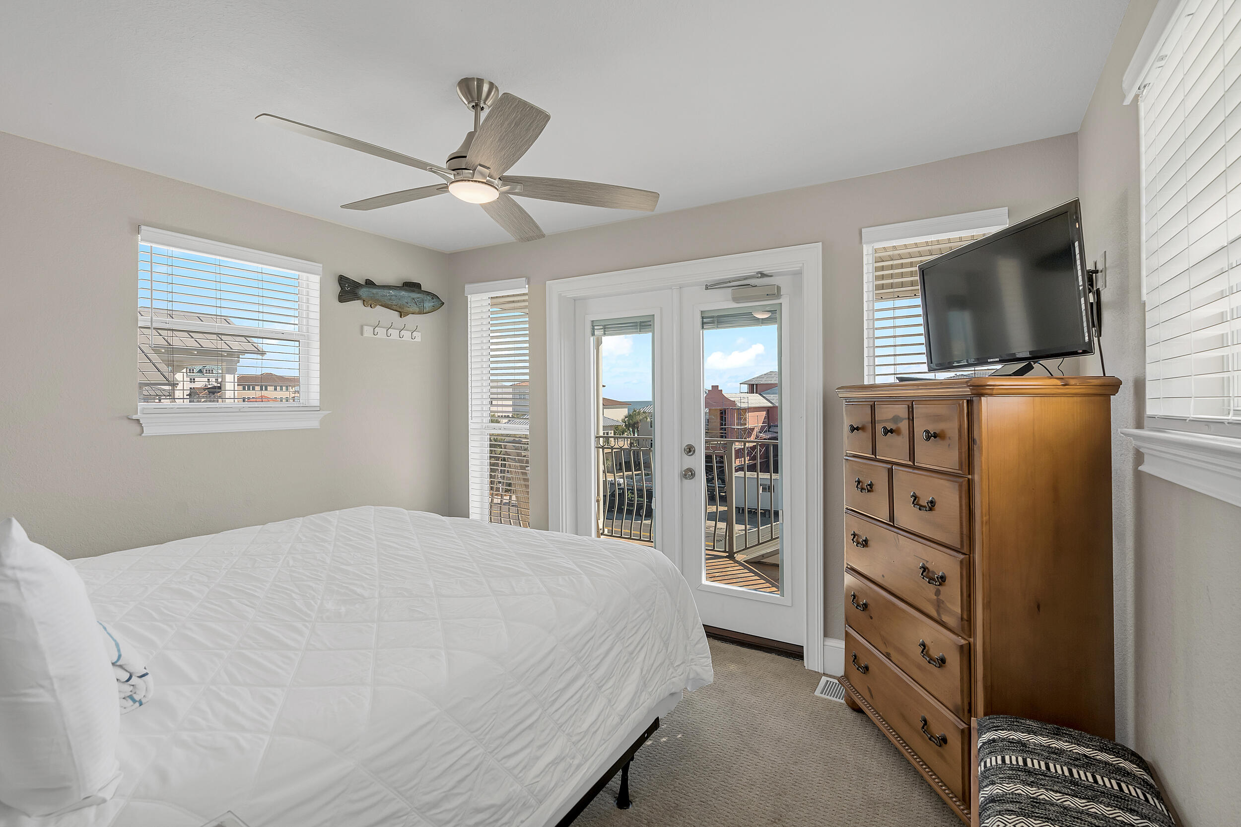 4482 Ocean View Drive Destin, FL 32541 - Photo 48 of 66 a bedroom with a bed and a flat screen tv