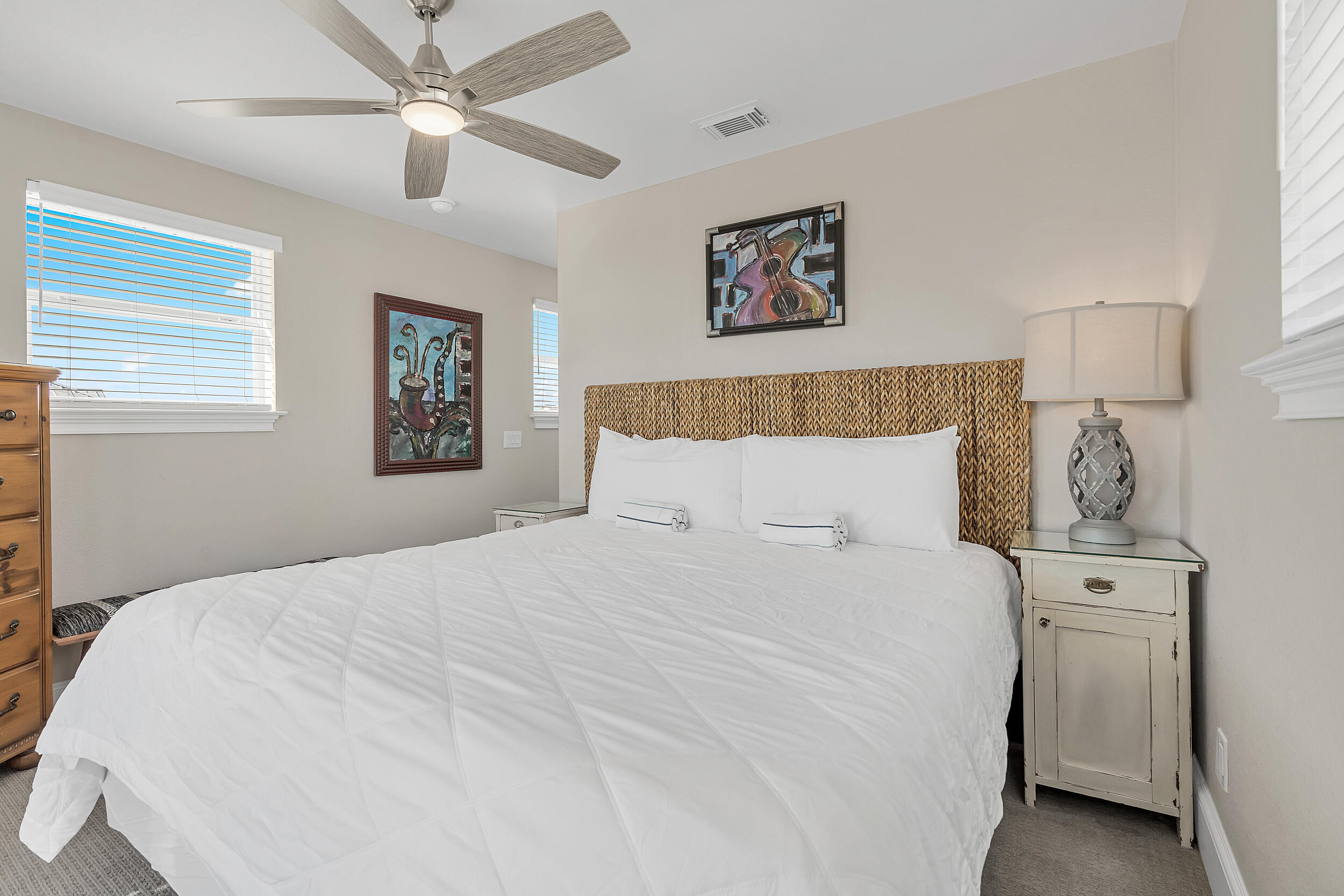 4482 Ocean View Drive Destin, FL 32541 - Photo 49 of 66 a bedroom with a large bed and a chandelier
