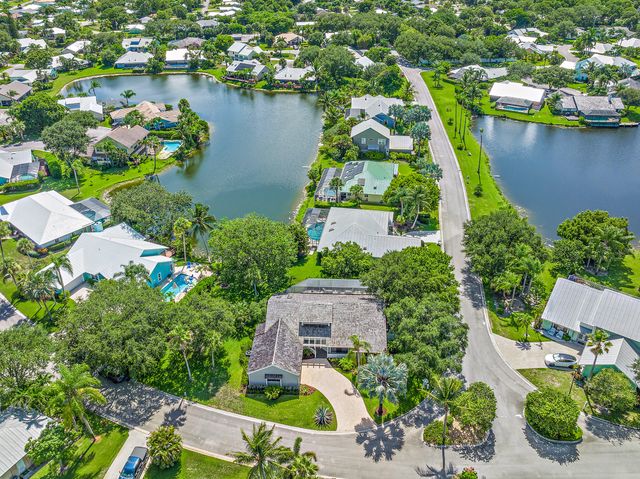 an aerial view of house with yard swimming pool and outdoor seating