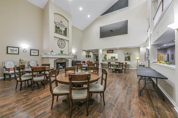 a view of a dining area with furniture and wooden floor