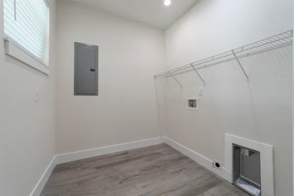 a view of a room with wooden floor