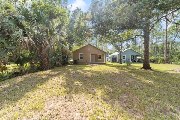 a house with trees in front of it
