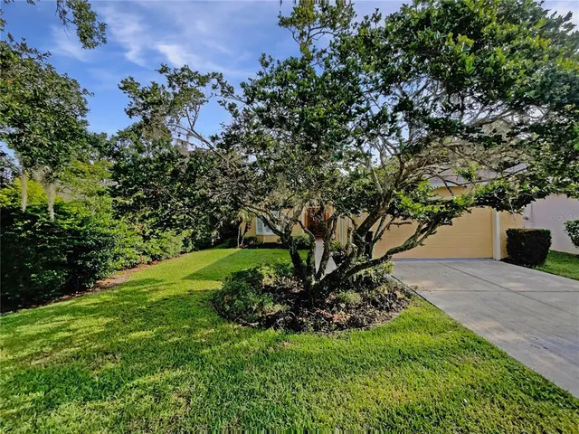 front view of a house with a big yard