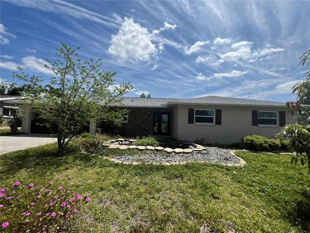 a backyard of a house with lots of green space