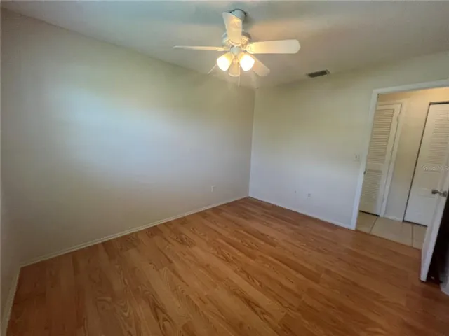 a view of an empty room and a window
