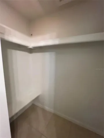 a bathroom with a toilet and shower curtain