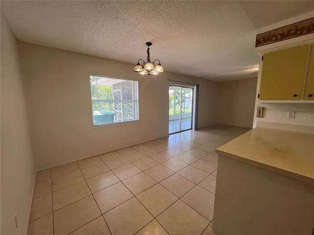 a view of a room that has a window in it