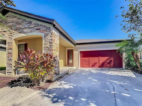 a view of yellow house with a yard