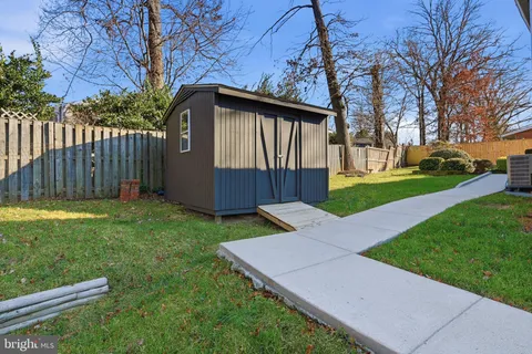 a view of a backyard with a tub and trees